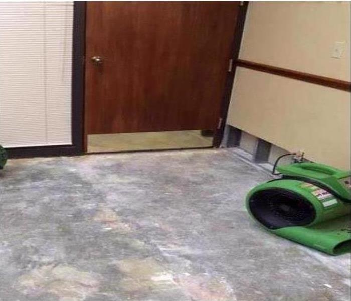 SERVPRO drying equipment sits on a dry floor, having removed the water.