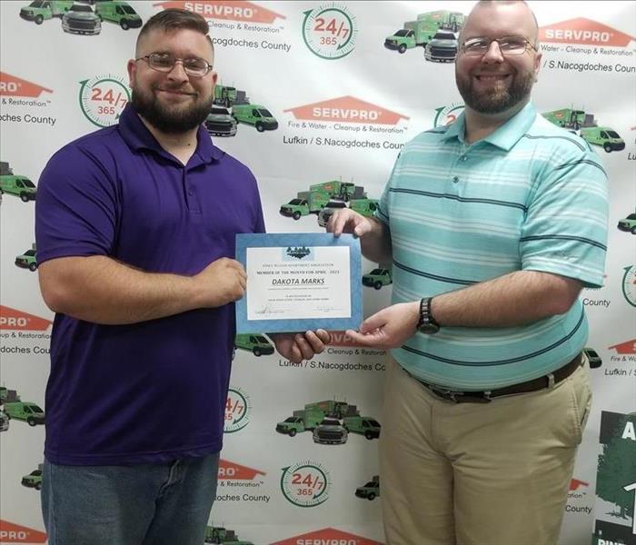 SERVPRO Employee with PWAA Member receiving award 