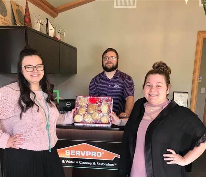 SERVPRO Employees holding cookies