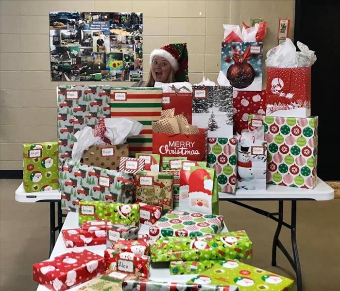 Our very own Buddy the Elf donated time to wrap Christmas presents for a local Habitat for Humanity 