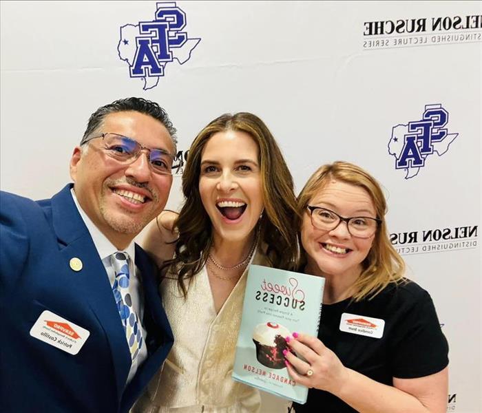 SERVPRO employees taking a selfie with Candace Nelson