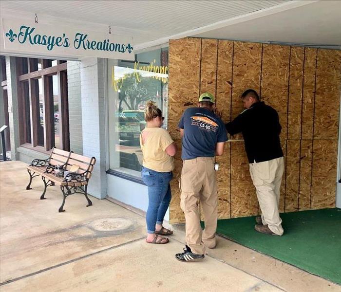 Our local SMR and staff boarding up window
