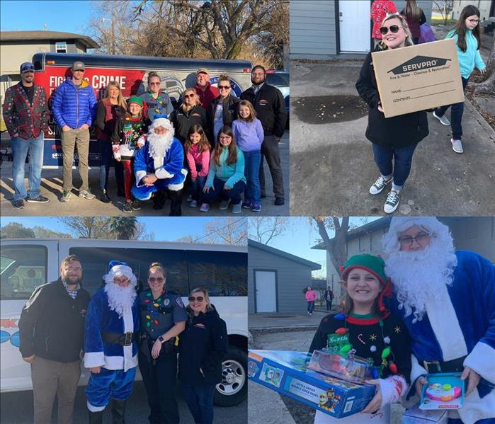 SERVPRO employee stand with Blue Santa from the Lufkin Police Department