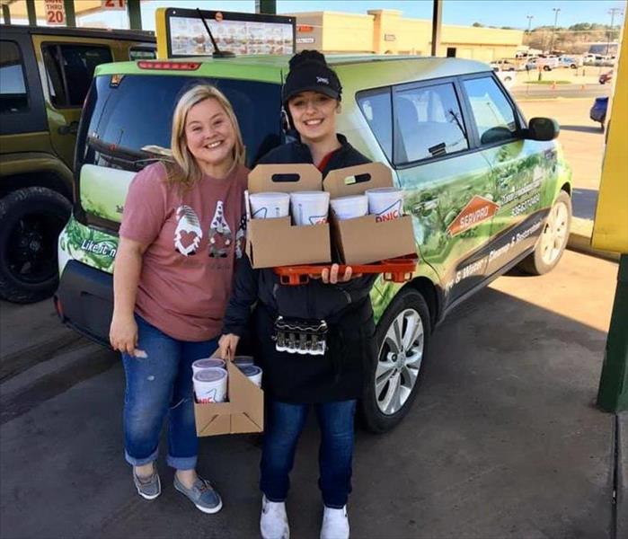Candice Stott and a Sonic carhop loading up drinks for Hudson ISD Teachers.