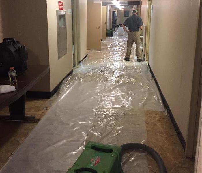 A flooded floor in a large room.