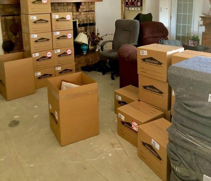 SERVPRO boxes stacked on top of each other inside a home.