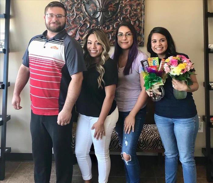 A group of people posing for a picture.