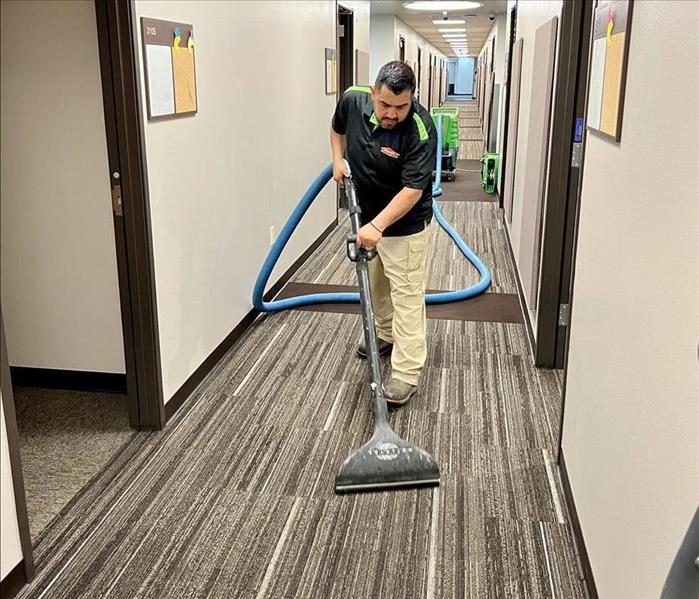SERVPRO employee with water extractor
