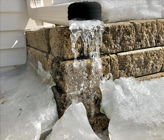 snow and frozen water in a gutter