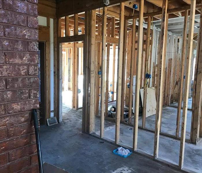 The inside of home during a rebuild, framing going up.