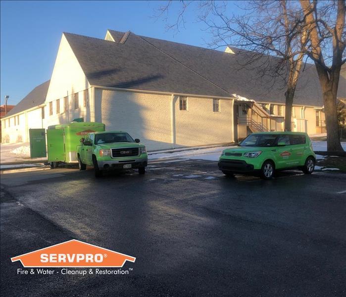 Two SERVPRO Vehicles in front of a water damaged church 