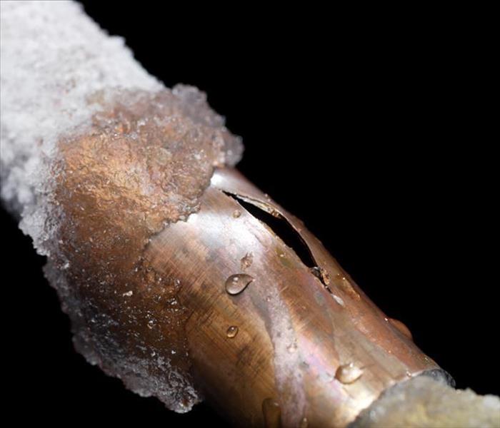 A frozen pipe that has burst open.